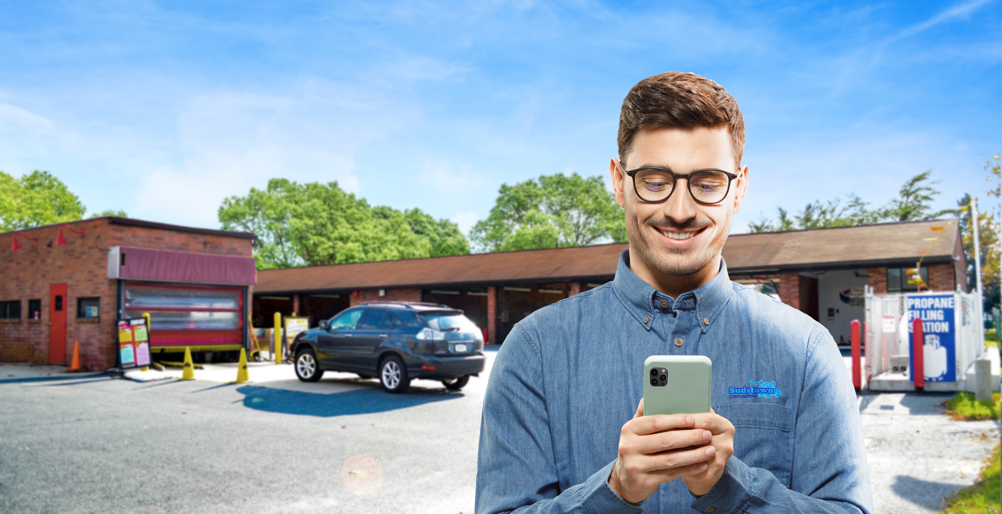 Man using phone at car wash